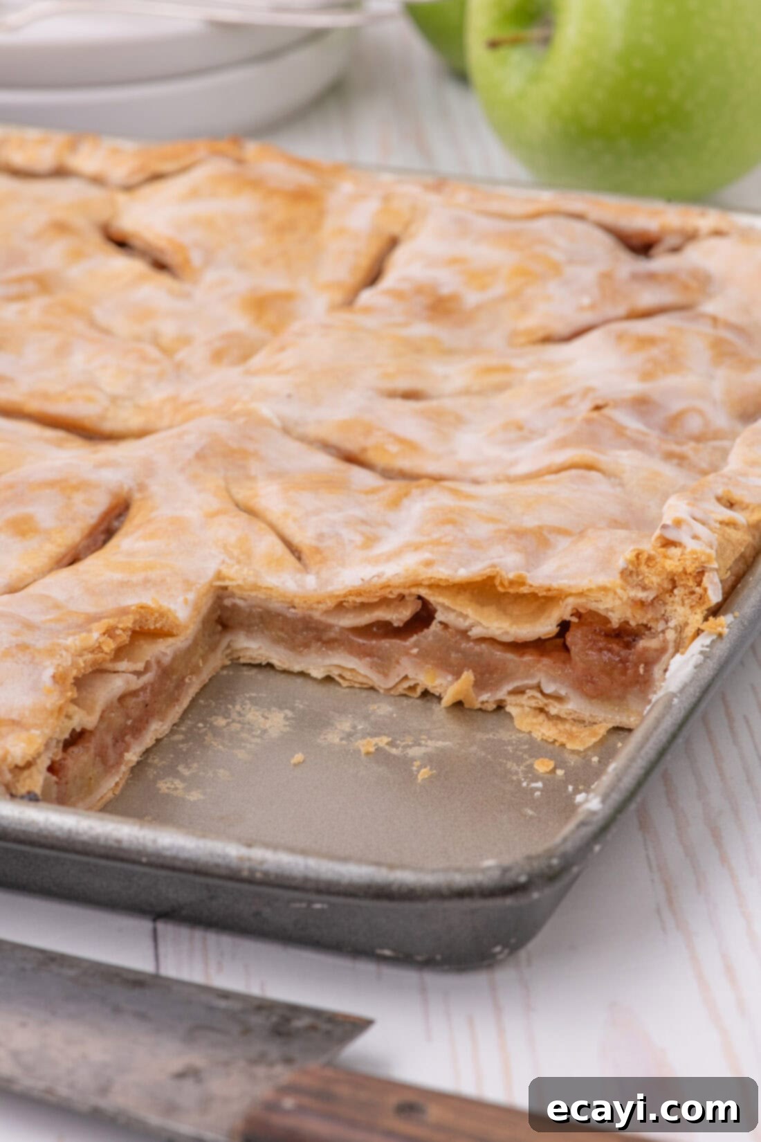Sheet Pan Apple Pie 16 Pan of Apple Slab Pie with a slice removed