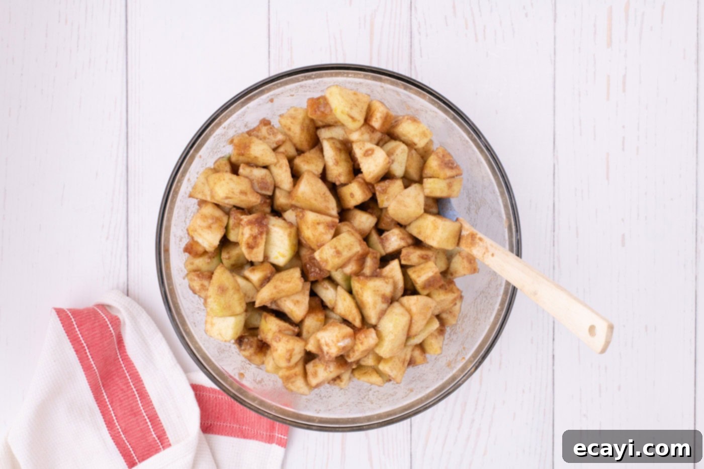Sheet Pan Apple Pie 5 chopped apples coated in spices for pie filling in a bowl
