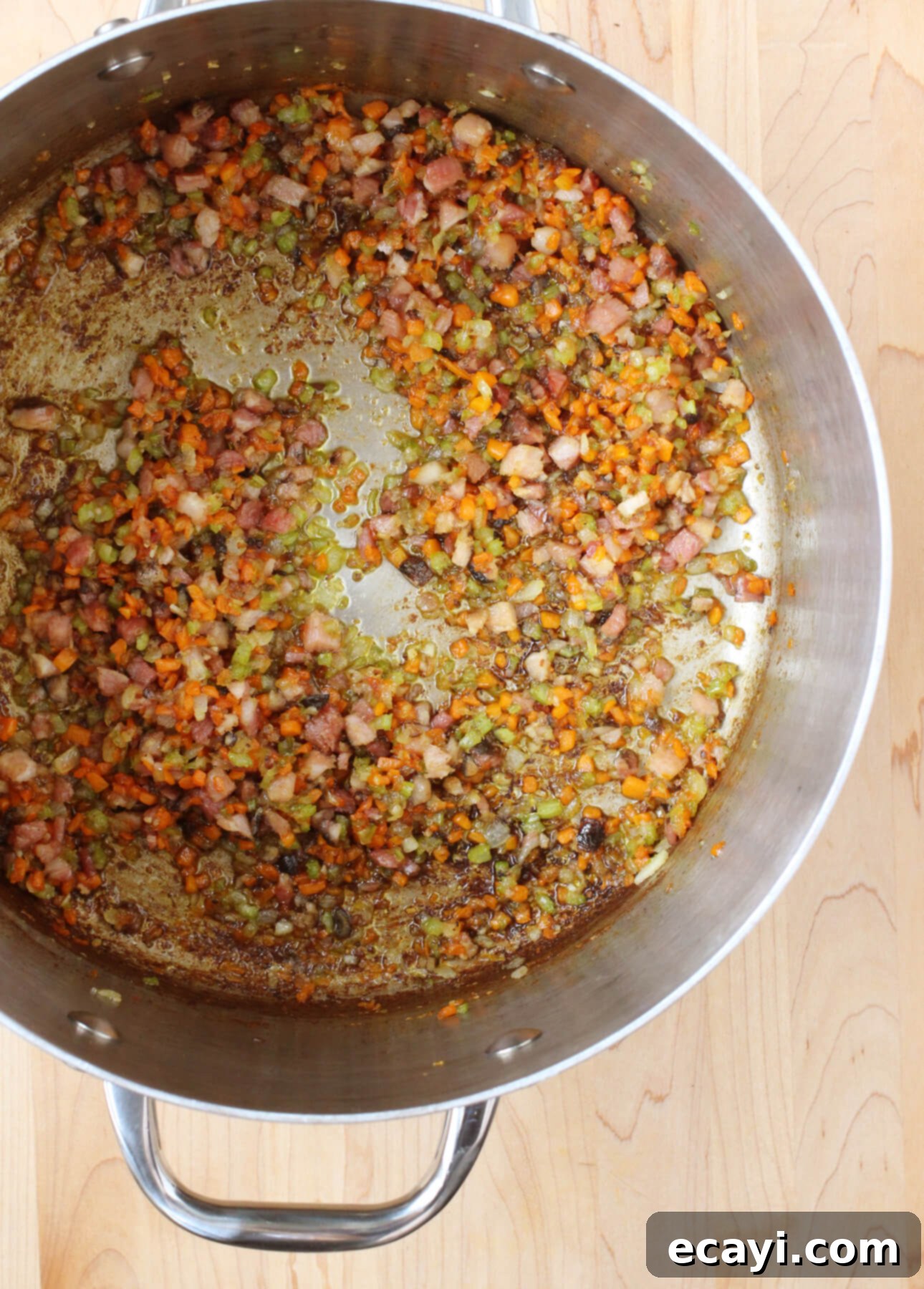Master Authentic Bolognese Sauce 11 Diced pancetta browning with soffritto vegetables for an authentic Italian Bolognese Sauce