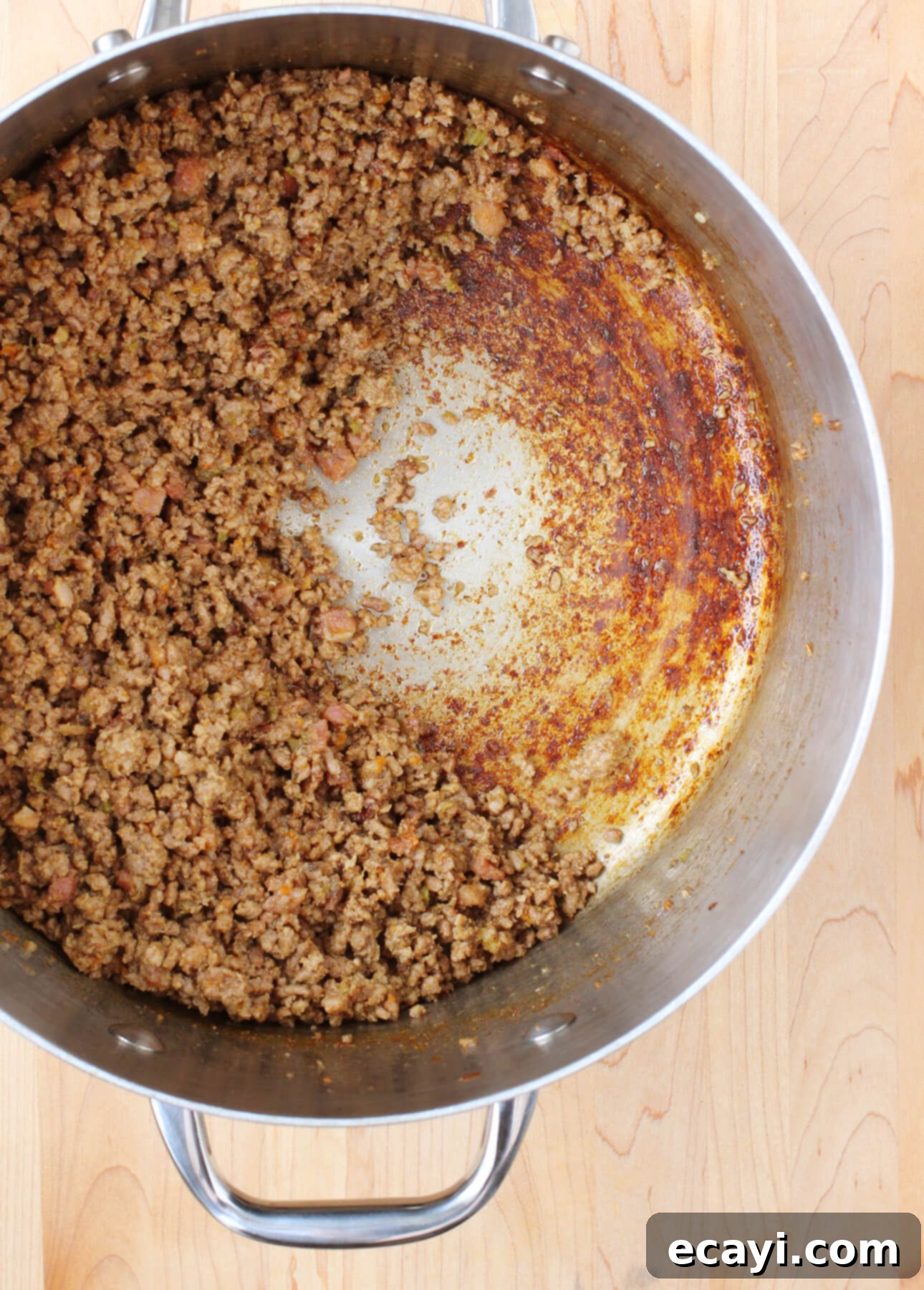 Master Authentic Bolognese Sauce 12 Ground meat caramelizing and browning in a pot for the Bolognese sauce, creating rich flavors