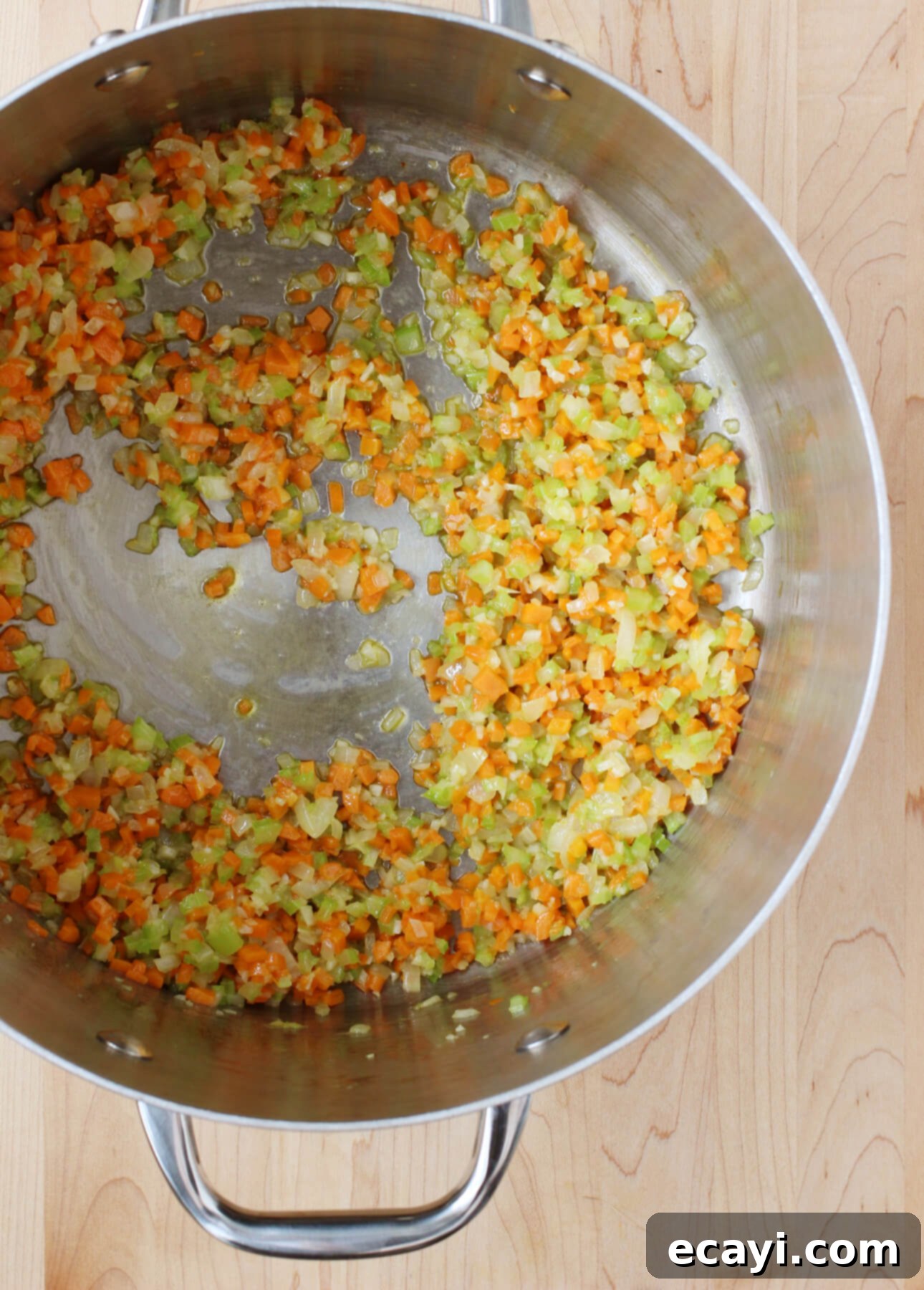 Master Authentic Bolognese Sauce 10 Soffritto vegetables gently cooking in olive oil and butter for Italian Bolognese Sauce