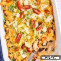 Cheesy Chicken Taco Casserole 12 Close up photo of a spoon in a Chicken Taco Casserole