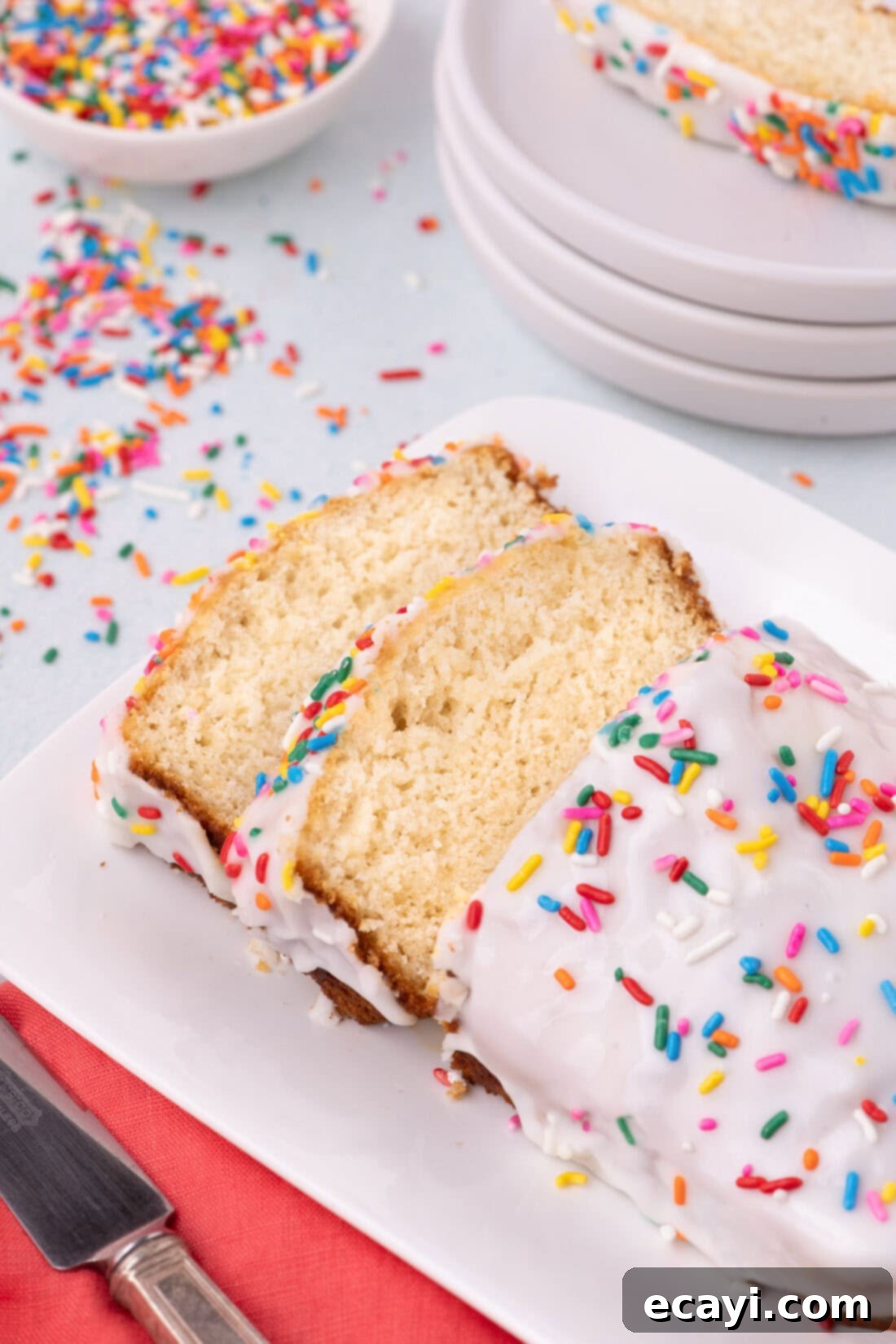 2-Ingredient Ice Cream Bread 2 Freshly baked ice cream bread on a plate, with two perfectly cut slices revealing its soft texture.