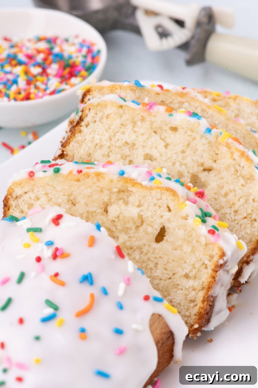 2-Ingredient Ice Cream Bread 12 Several slices of glazed ice cream bread, beautifully arranged and ready to be served, highlighting the soft interior.