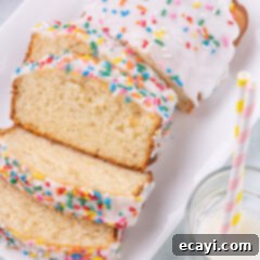 2-Ingredient Ice Cream Bread 13 Ice Cream Bread cut into slices on a white platter