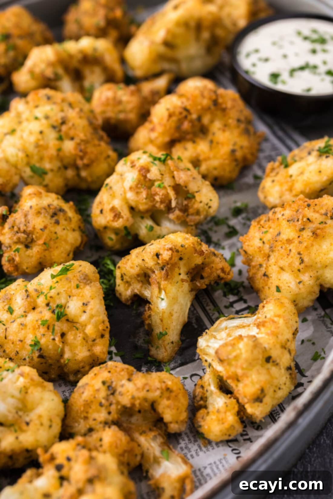 Golden Fried Florets 2 Close up photo of Fried Cauliflower in a serving tray, showcasing its golden, crispy exterior