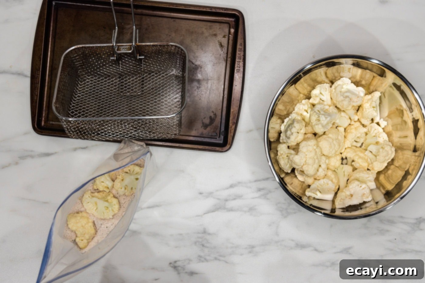 Golden Fried Florets 9 A hand shaking a zipper bag filled with seasoned flour and cauliflower florets, ensuring an even coating