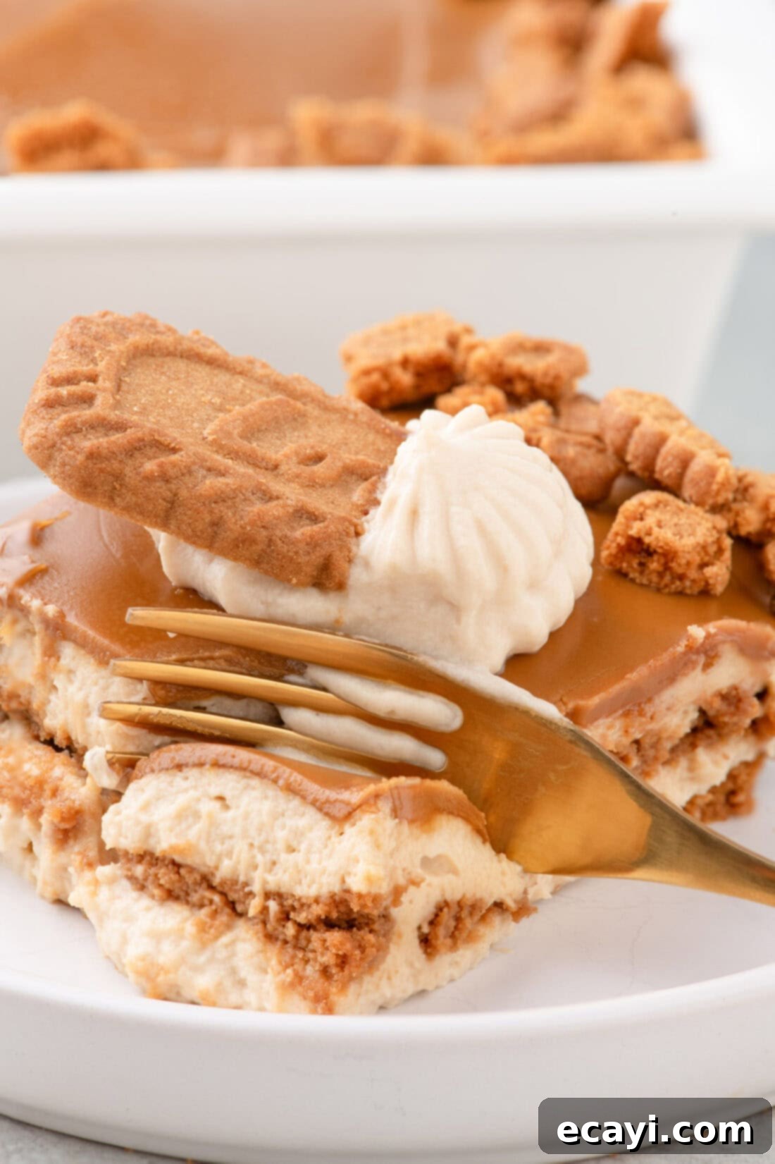 No-Bake Biscoff Bliss 2 Fork breaking apart a piece of Biscoff Icebox Cake revealing its soft, layered texture