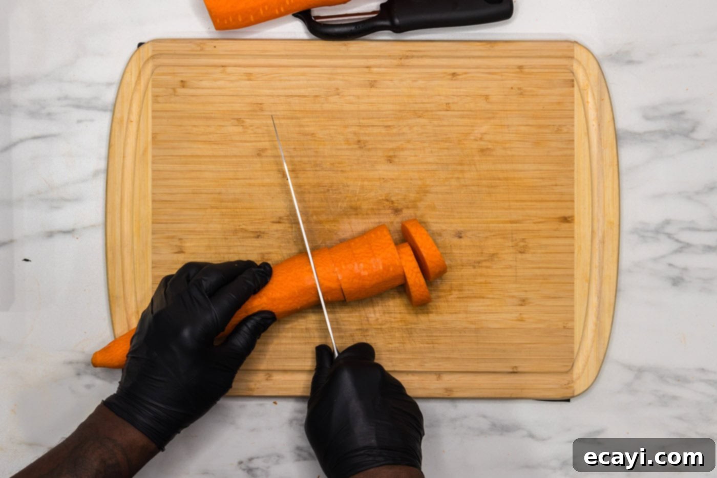 Golden Carrot Crush 6 slicing carrot into coins on a cutting board