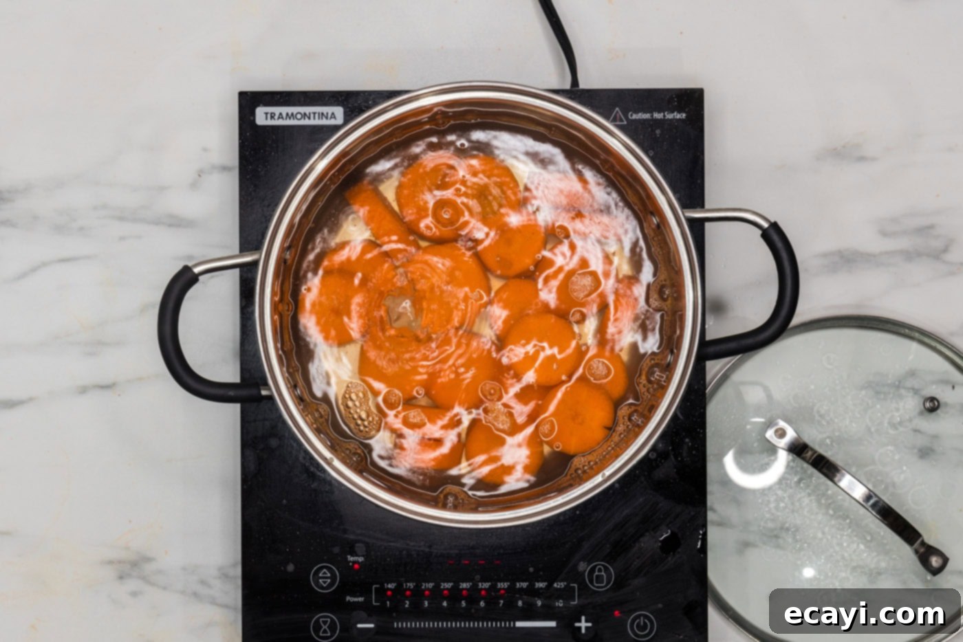 Golden Carrot Crush 7 boiling carrots in a pot of water