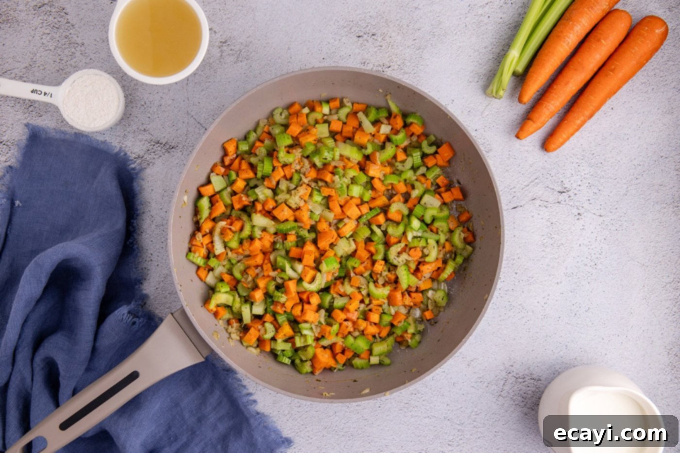 Hearty Chicken Pot Pie Casserole 6 sauteed carrots, onion, and celery in a skillet with butter