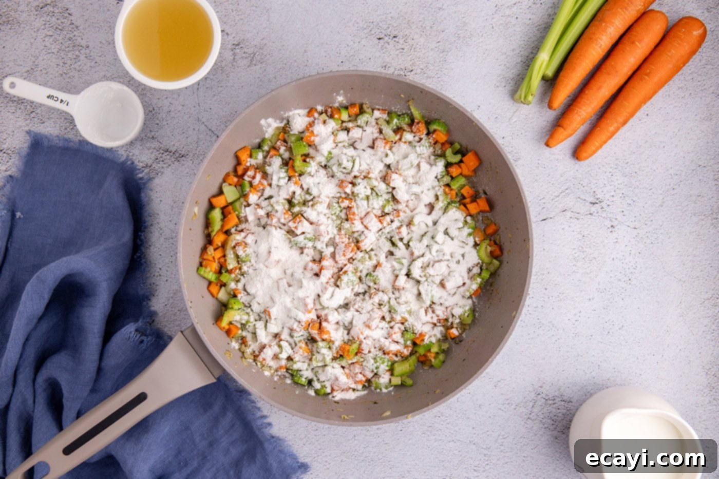 Hearty Chicken Pot Pie Casserole 7 flour sprinkled over veggies in a skillet