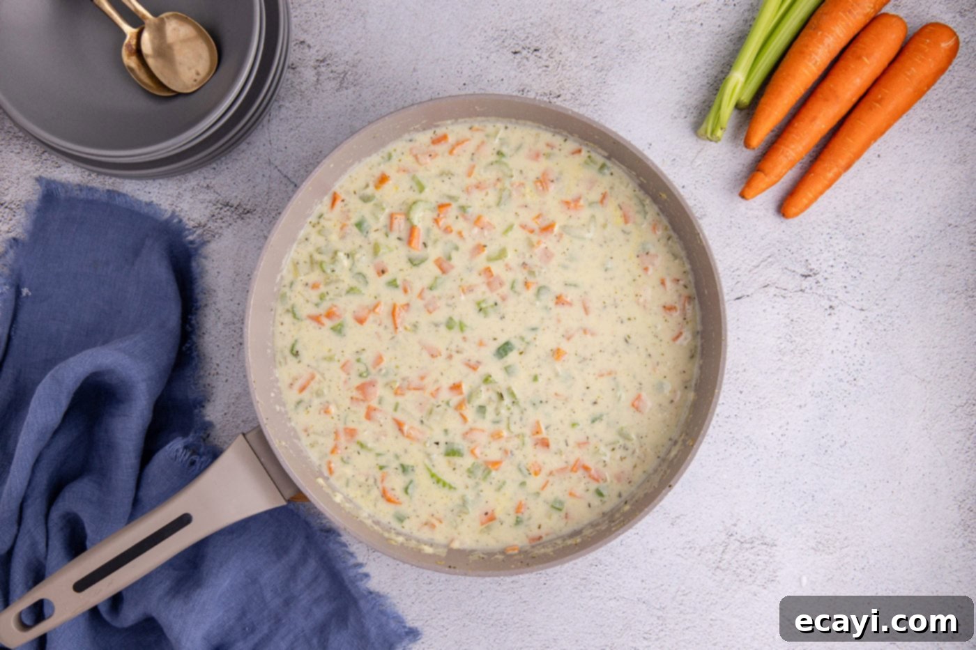 Hearty Chicken Pot Pie Casserole 8 milk and chicken stock added to pot pie mixture in a skillet