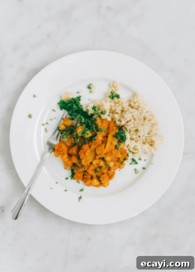 Perfect Pantry Chana Masala and Brown Rice 2 A vibrant bowl of Allison Day's Pantry Chana Masala with Brown Rice, a perfect comfort food recipe from Yummy Beet featured in the Cooking with Friends series.