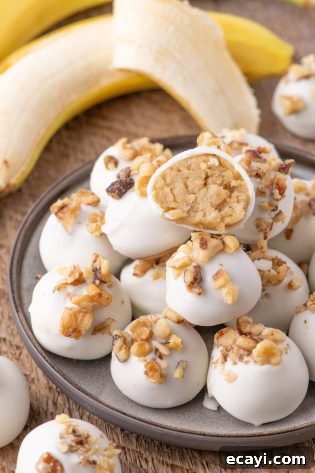 Banana Bliss Truffles 2 Banana Truffles stacked on a plate with one cut in half