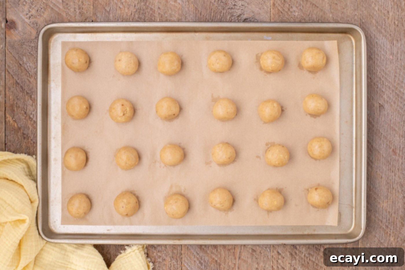 Banana Bliss Truffles 11 banana truffles on a parchment lined baking sheet