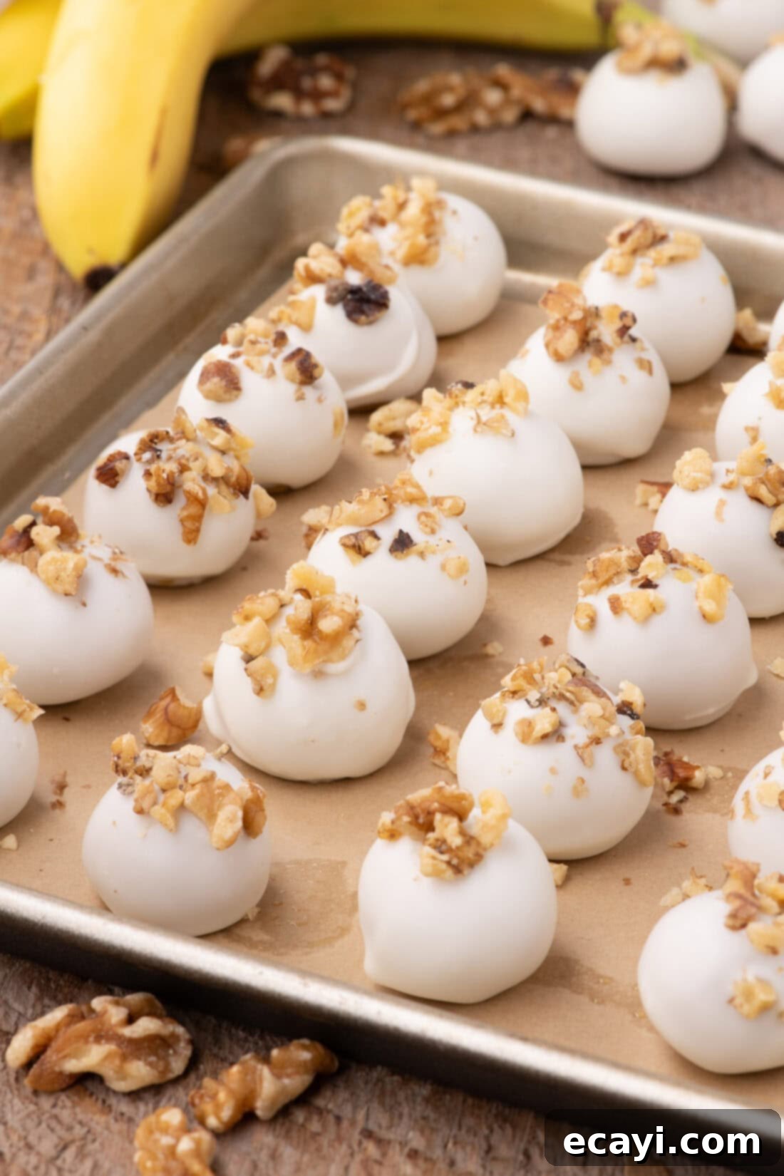 Banana Bliss Truffles 3 Banana Truffles on a parchment lined baking sheet