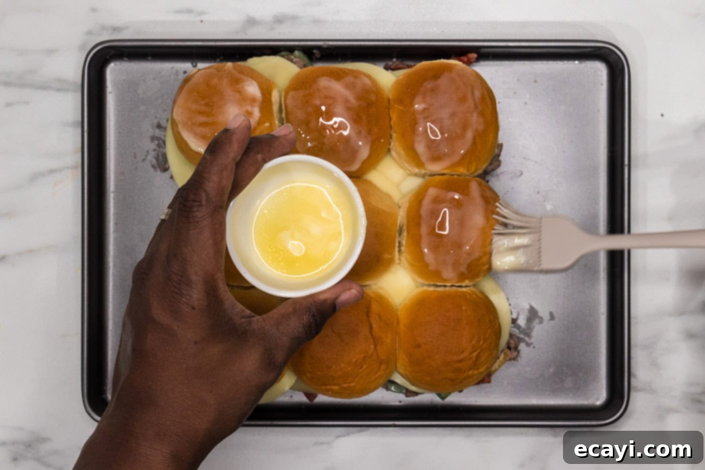 Cheesesteak Slider Bites 11 basting philly cheesesteak sliders with melted butter