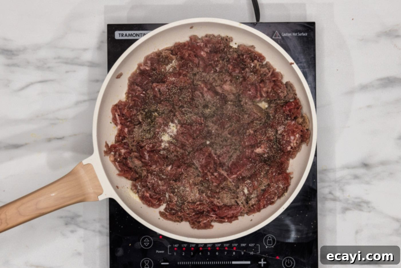 Cheesesteak Slider Bites 5 browned shaved beef in a skillet