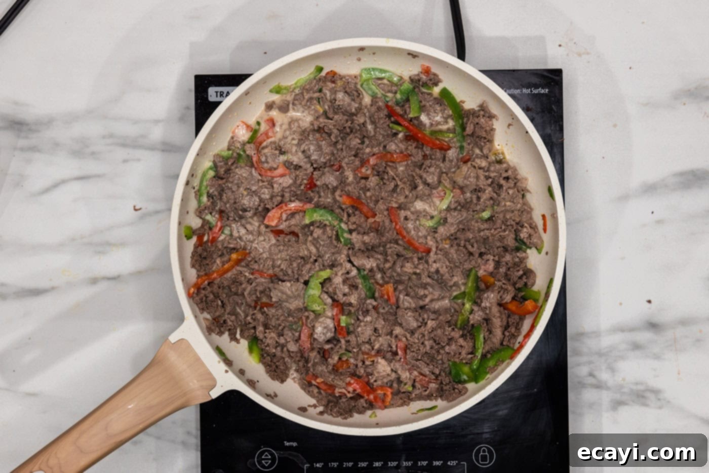 Cheesesteak Slider Bites 8 bell peppers, beef, and queso in a skillet