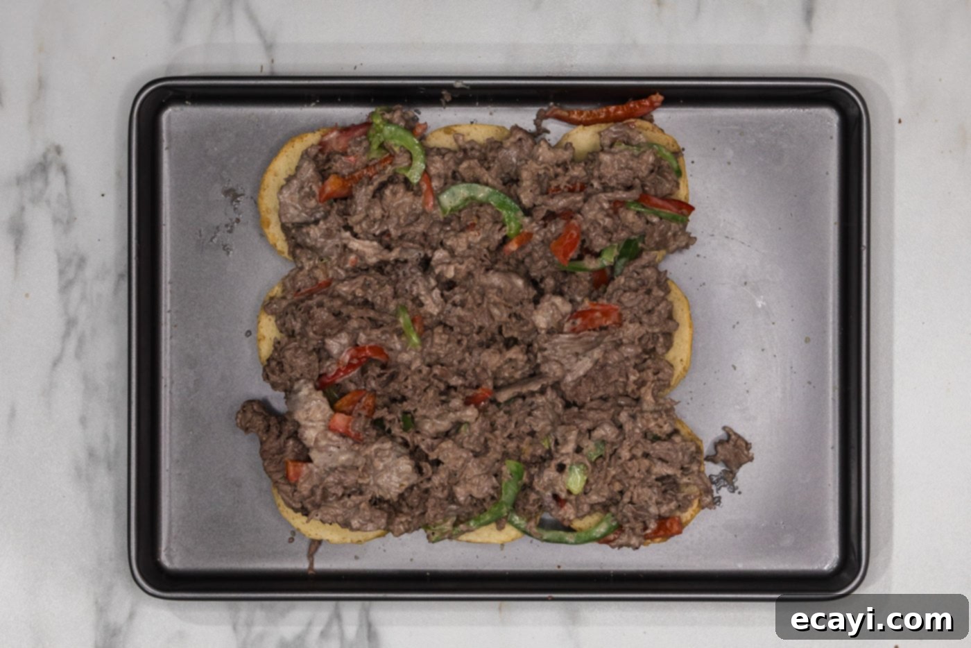 Cheesesteak Slider Bites 9 shaved beef and bell pepper mixture on top of slider buns