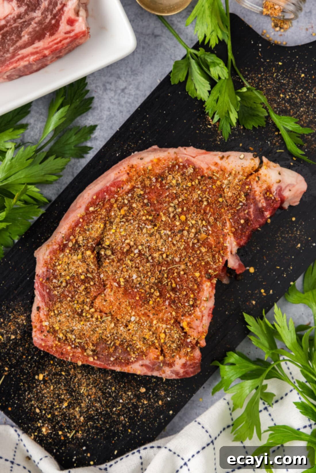 Crafting Your Own Montreal Steakhouse Blend 3 Homemade Montreal Steak Seasoning generously applied on a raw steak, ready for grilling or searing.