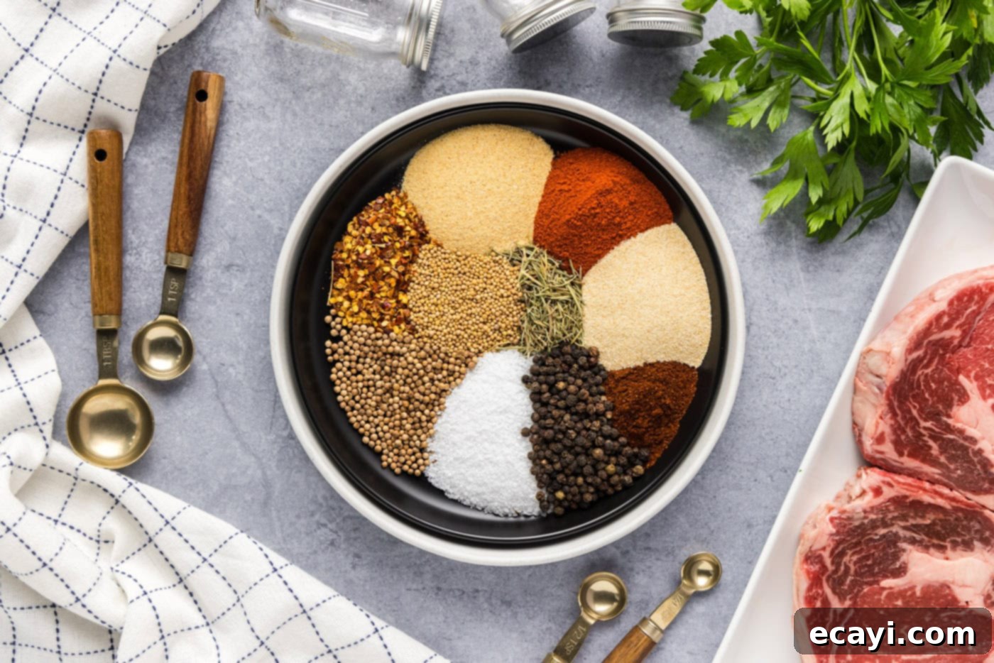 Crafting Your Own Montreal Steakhouse Blend 5 All the dry spices and herbs for Montreal Steak Seasoning neatly arranged in a bowl, ready for grinding.