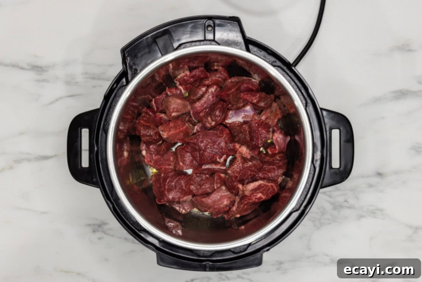 Easy Instant Pot Beef Tips and Gravy 6 browning beef chunks in instant pot trivet