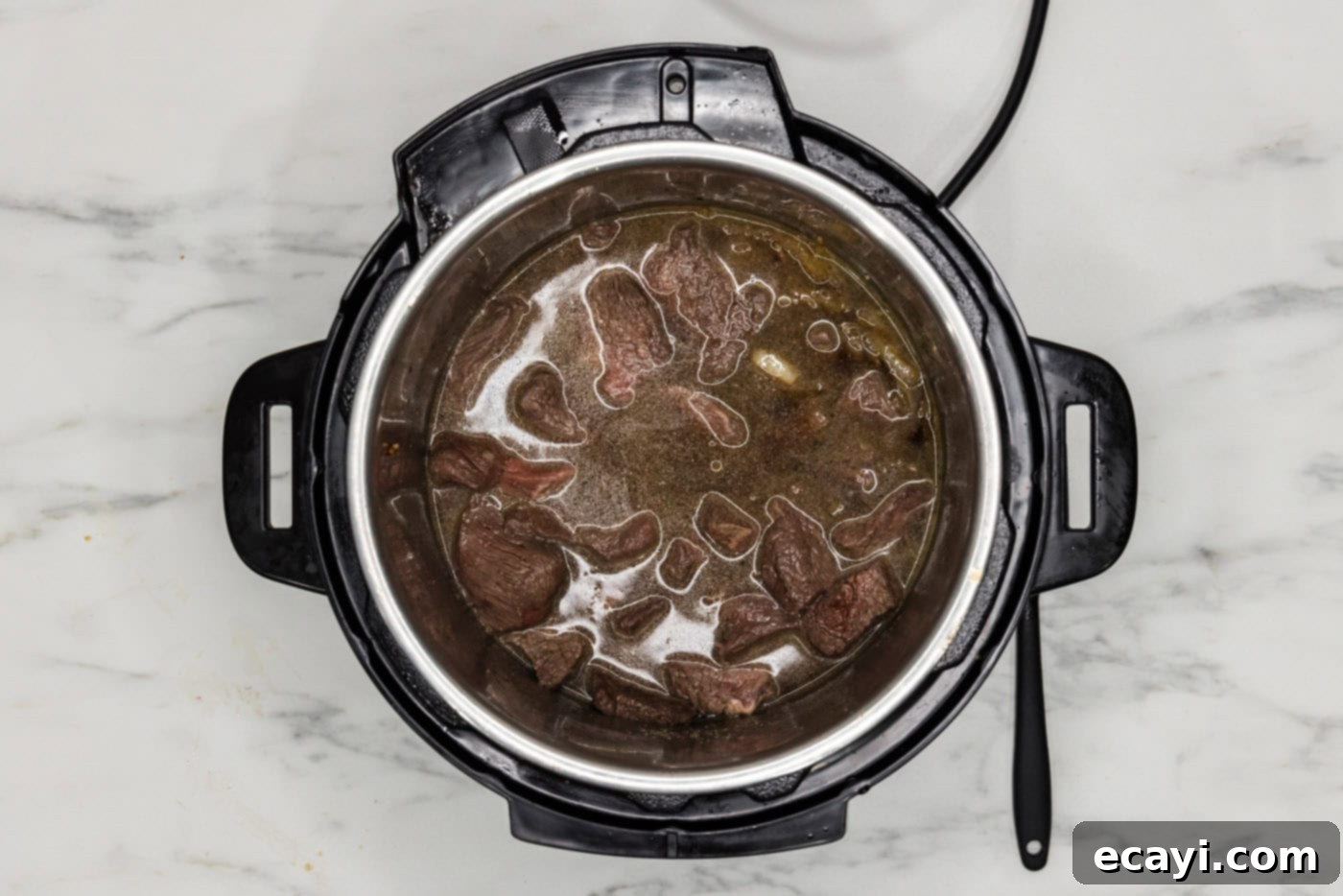 Easy Instant Pot Beef Tips and Gravy 9 beef tips in the instant pot with gravy