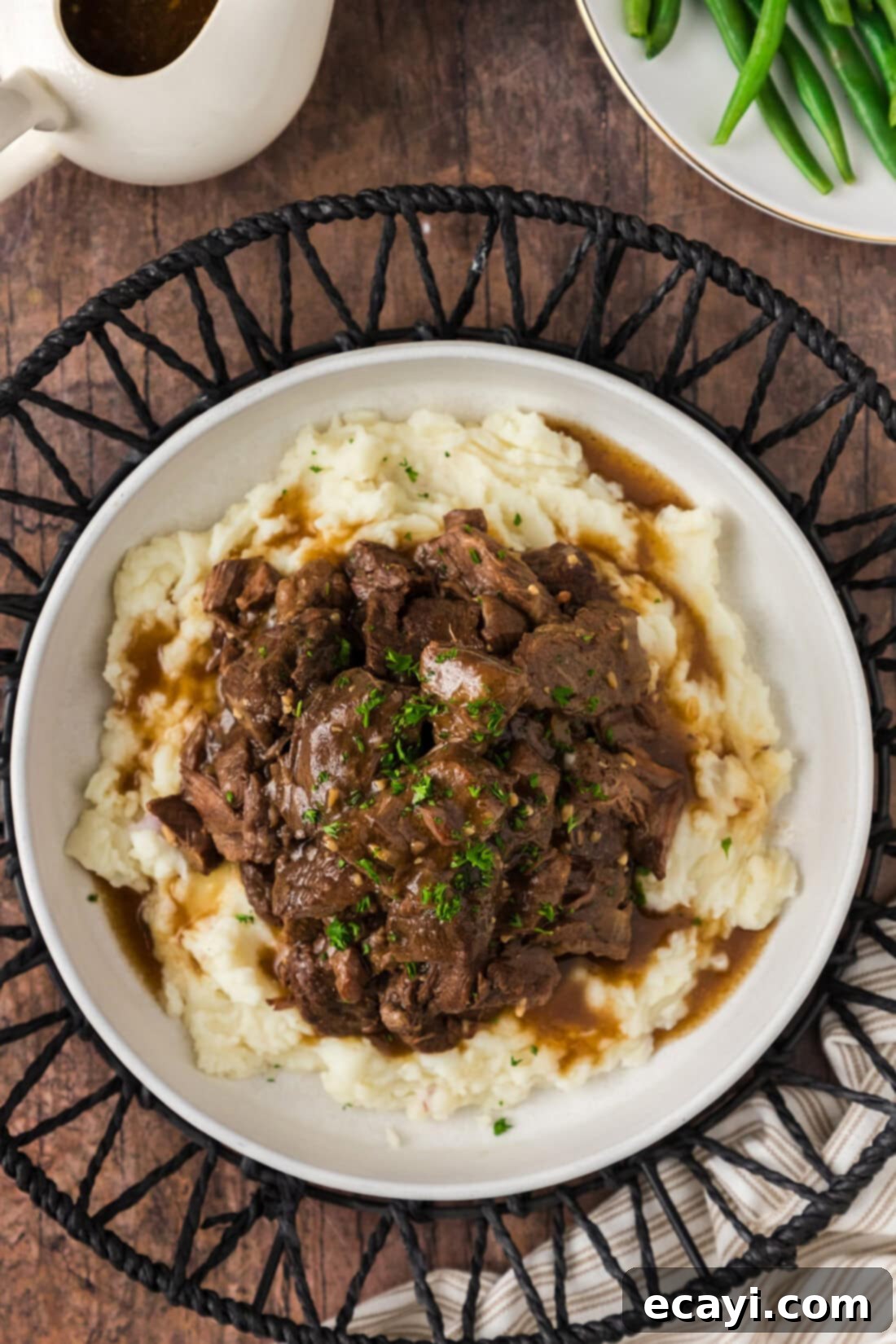 Easy Instant Pot Beef Tips and Gravy 10 Overhead photo of Instant Pot Beef Tips and Gravy served over mashed potatoes
