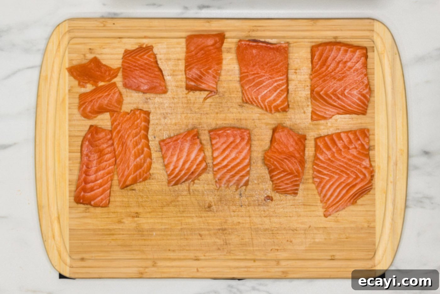 Gourmet Salmon Sliders 5 salmon cut into small portions on a cutting board