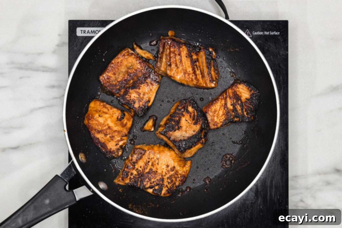 Gourmet Salmon Sliders 9 cooked salmon in a skillet