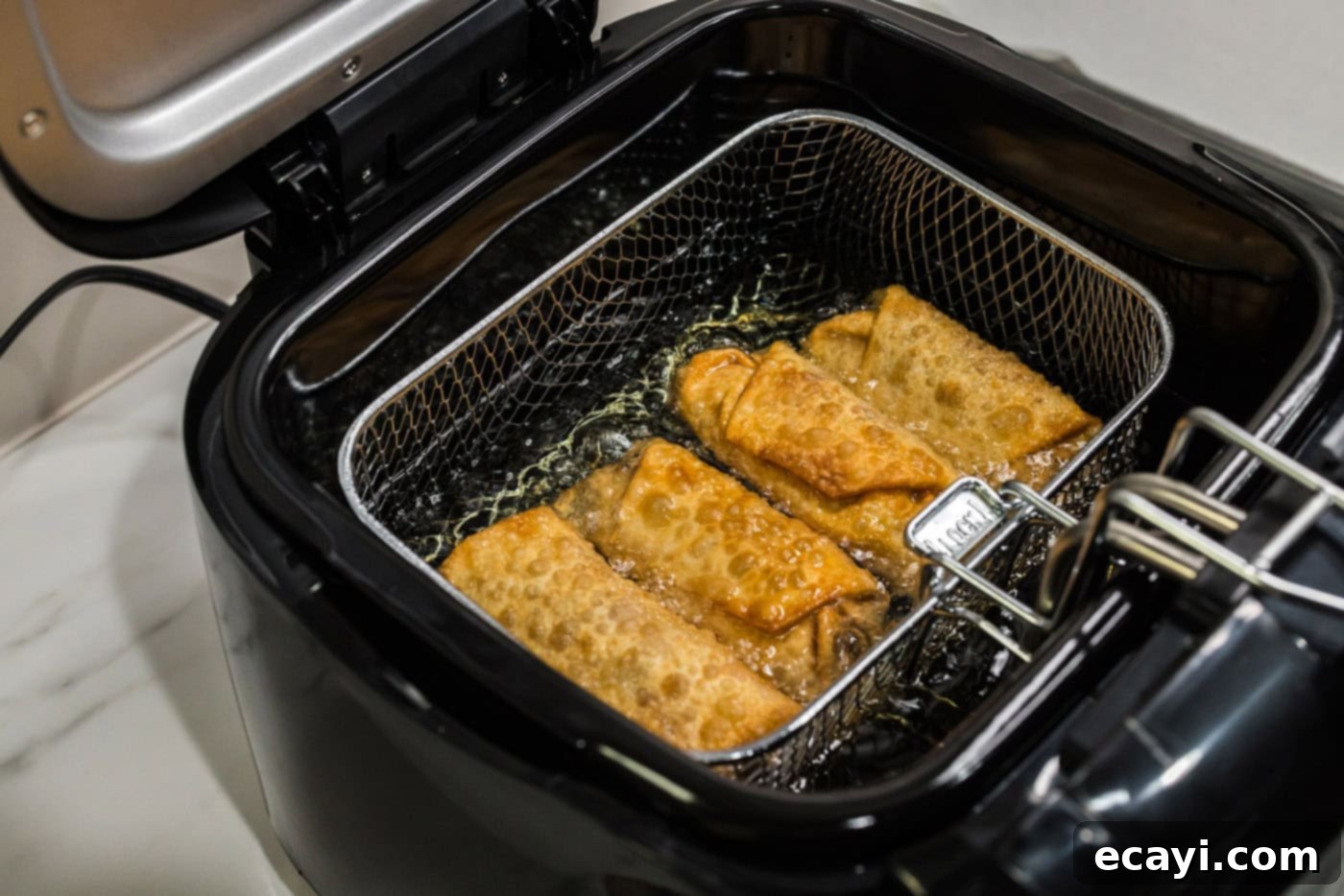 Crispy Corned Beef Egg Rolls 13 deep fried egg rolls in fryer basket