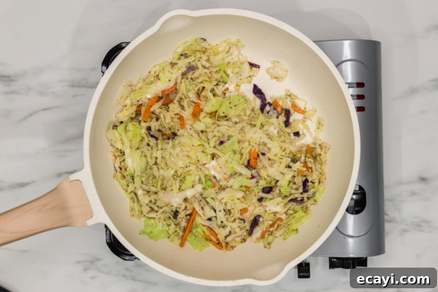 Crispy Corned Beef Egg Rolls 5 sauteed coleslaw in a skillet