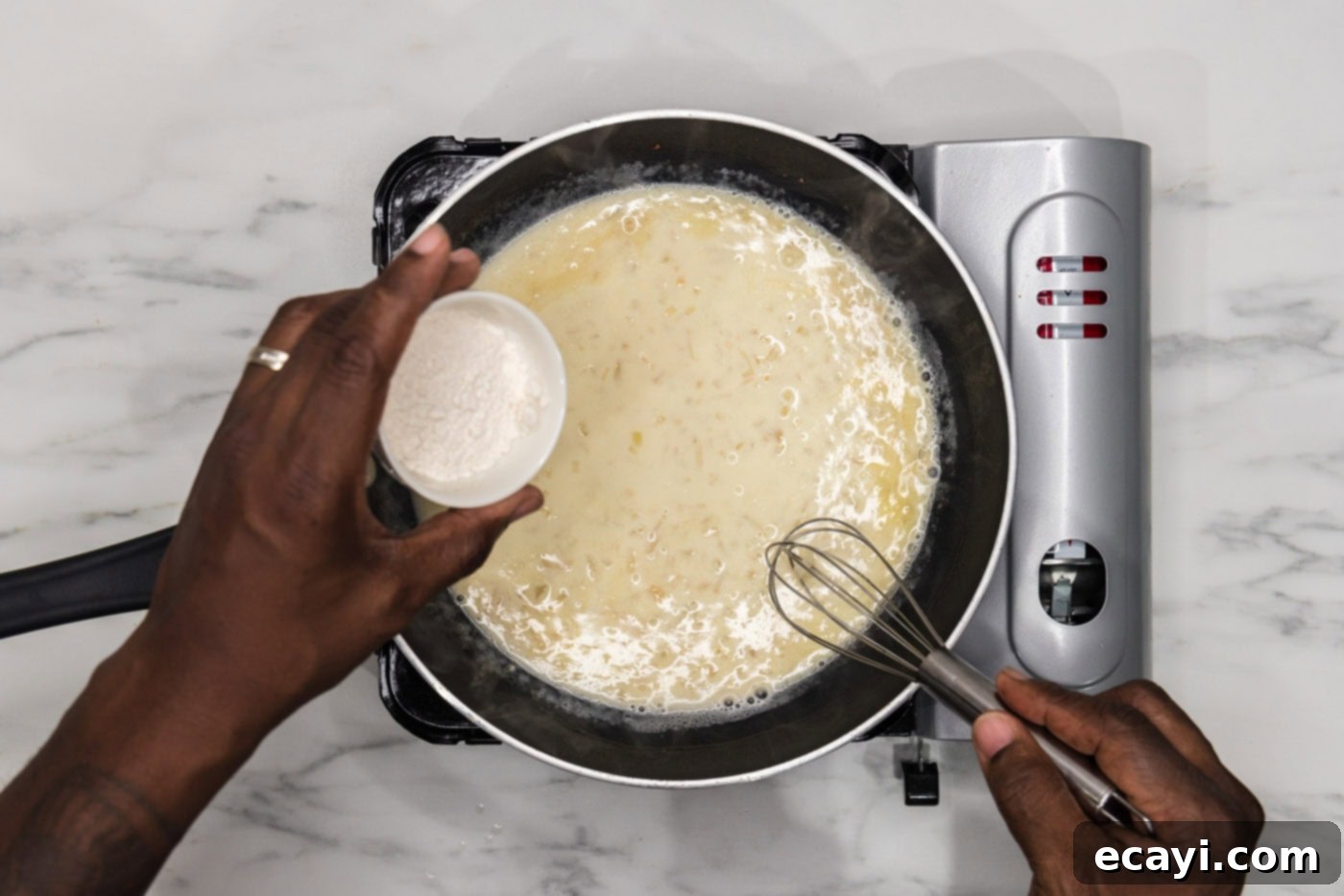 Perfectly Baked Chilean Sea Bass 10 Whisking all-purpose flour into the creamy sauce in a skillet, to achieve the perfect thickened beurre blanc consistency.