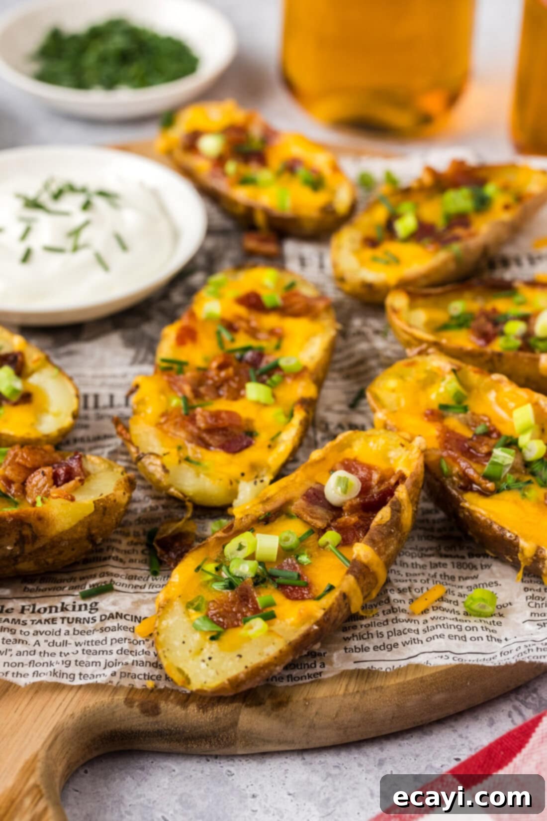 Loaded Potato Boats 2 Close up photo of Potato Skins on a wooden platter
