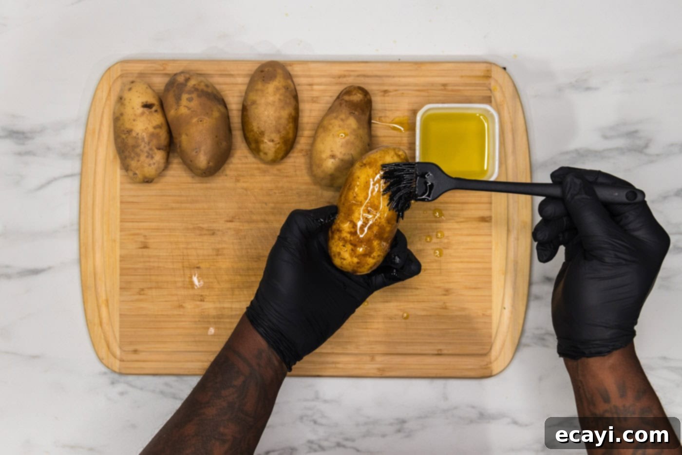 Loaded Potato Boats 5 brushing russet potato skin with olive oil