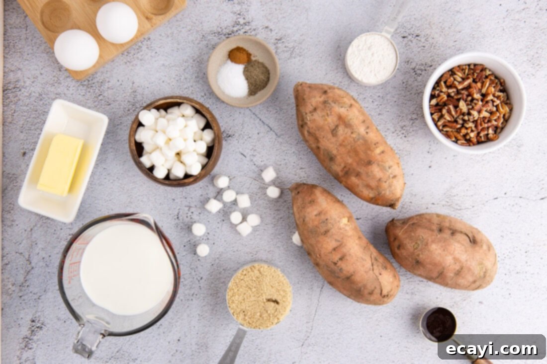Golden Sweet Potato Bliss 4 A flat lay photograph displaying all the fresh ingredients needed for Sweet Potato Casserole, including whole sweet potatoes, butter, milk, sugar, spices, pecans, and marshmallows.