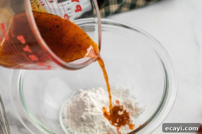 Hearty Slow Cooker Hungarian Goulash with Noodles 12 adding broth to cornstarch