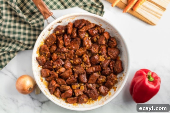 Hearty Slow Cooker Hungarian Goulash with Noodles 7 browned beef cubes in a skillet