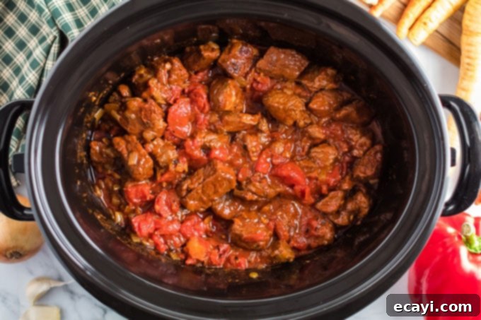 Hearty Slow Cooker Hungarian Goulash with Noodles 9 beef in crockpot