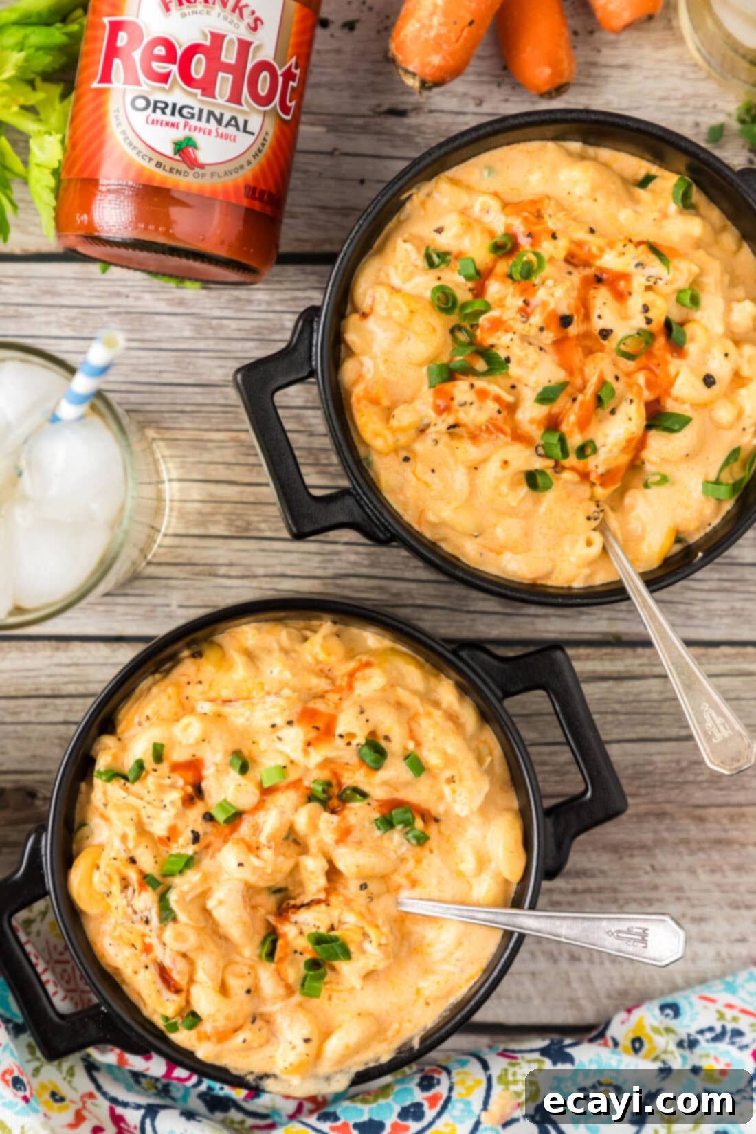 Buffalo Mac Bliss 2 Two bowls of Buffalo Chicken Mac and Cheese topped with green onions