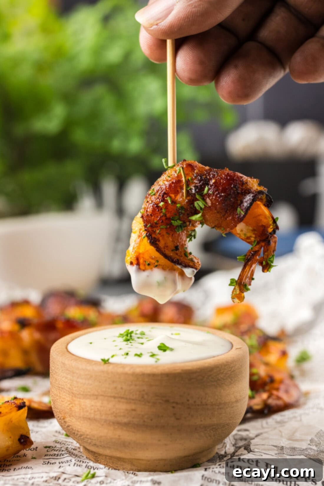 Crispy Air Fryer Bacon Wrapped Shrimp 3 Air Fryer Bacon Wrapped Shrimp on a toothpick, ready for dipping in ranch.