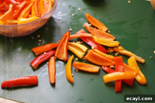 Savory Chicken and Pepper Pasta 5 A close up photo of chopped red and orange sweet peppers.