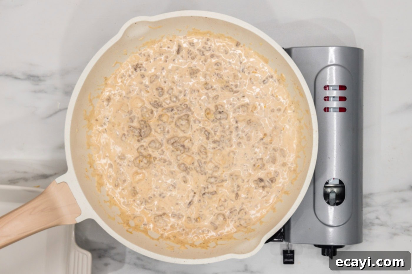 Loaded Cheeseburger Dip 11 cheeseburger dip mixture in a skillet