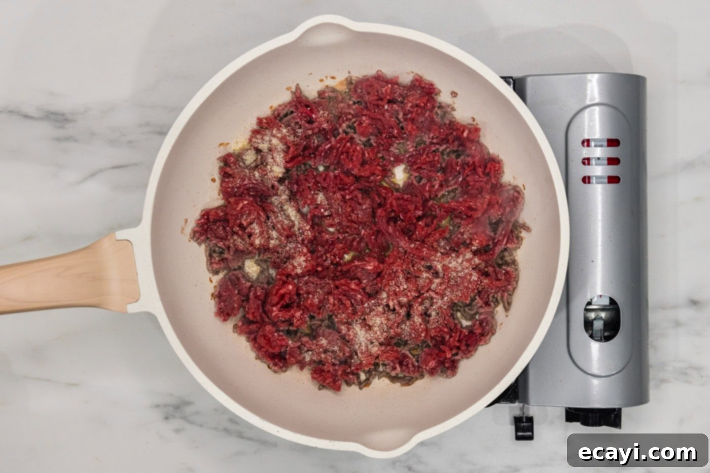 Loaded Cheeseburger Dip 5 ground beef with seasonings in a skillet