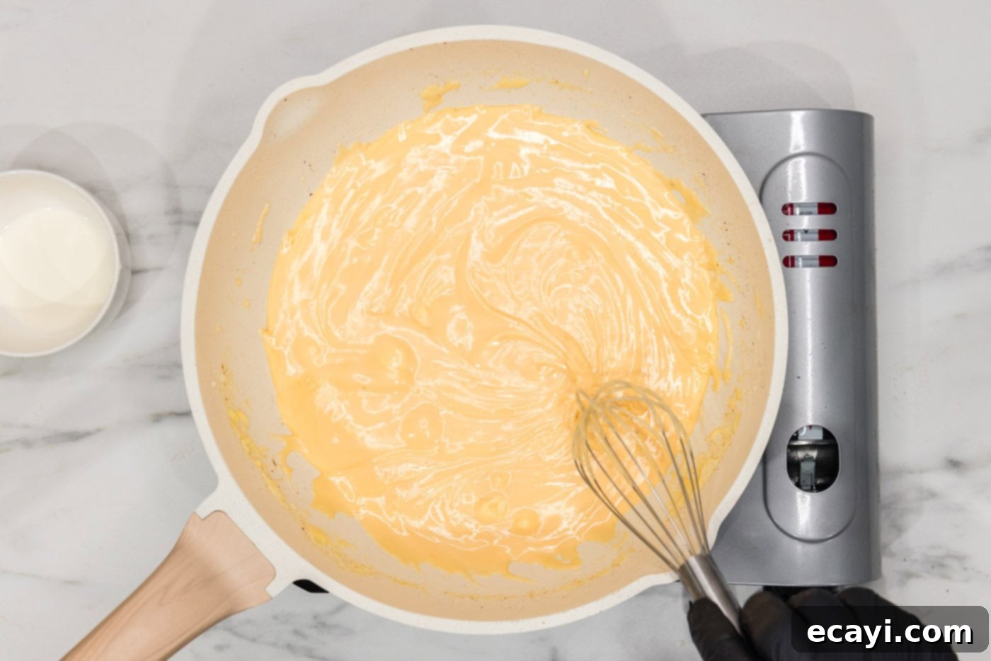 Loaded Cheeseburger Dip 8 whisking cream cheese sauce in a skillet