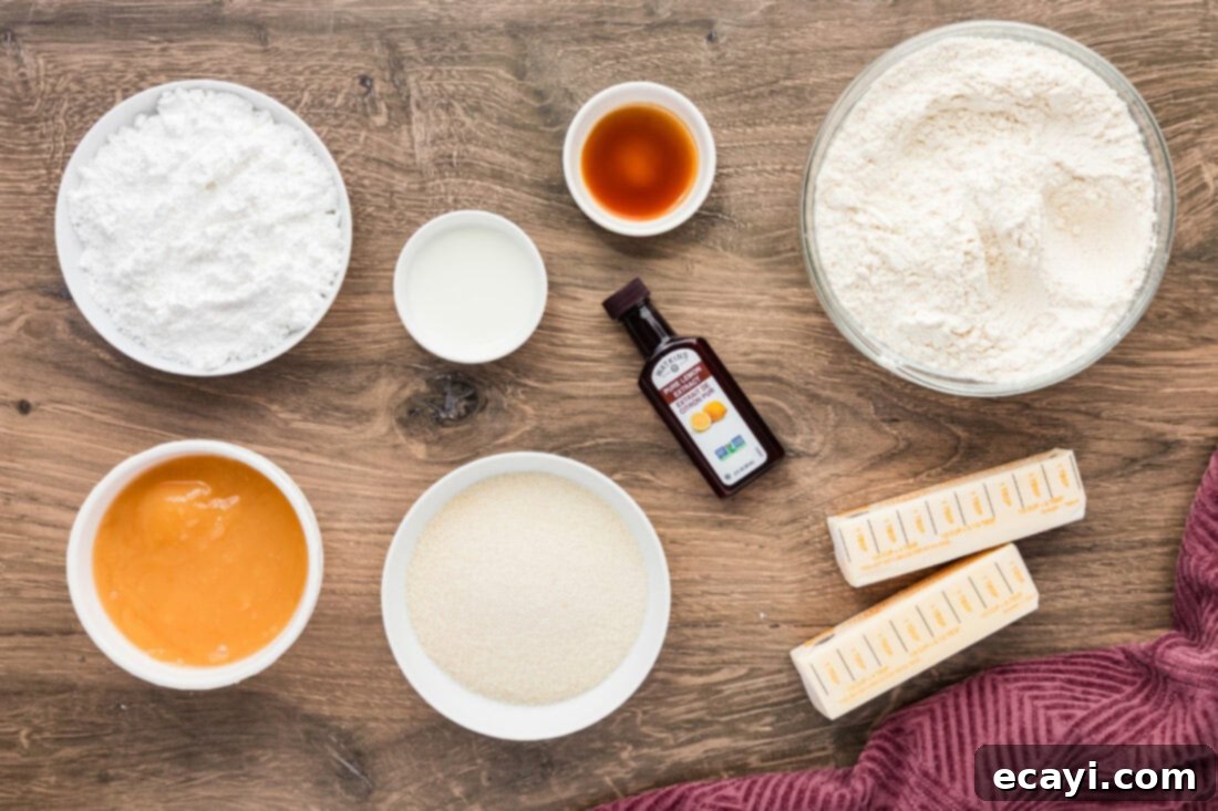 Zesty Lemon Crumble Bars 4 A flat lay photograph displaying all the ingredients needed for Lemon Streusel Squares, including flour, sugar, butter, vanilla, lemon curd, powdered sugar, lemon extract, and milk.