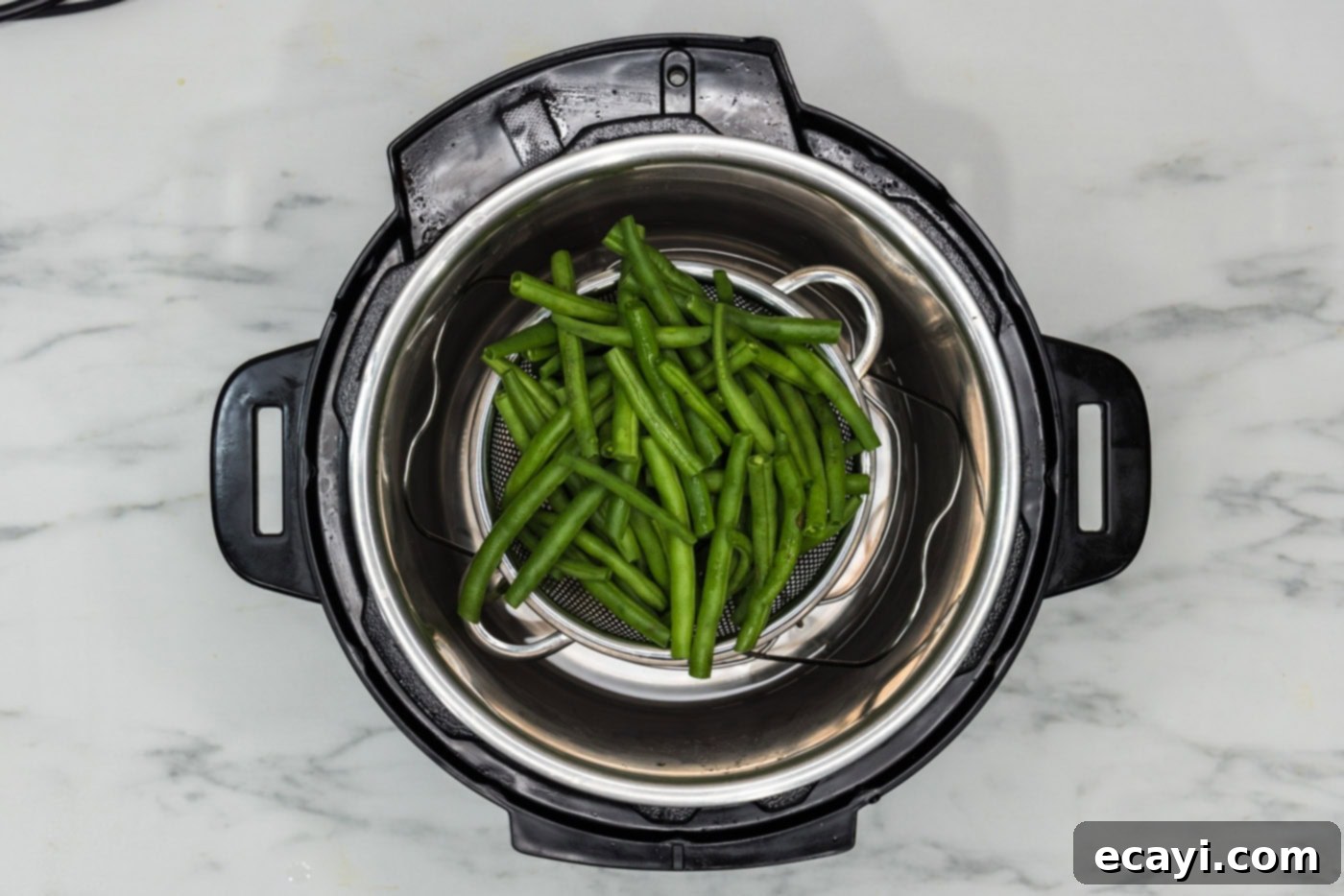 Perfect Instant Pot Green Beans 6 Fresh green beans placed in a metal basket accessory inside an Instant Pot