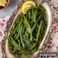 Perfect Instant Pot Green Beans 9 Instant Pot Green Beans in a metal platter topped with freshly grated parmesan cheese